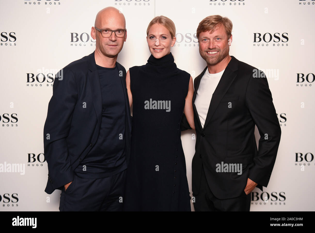 left to right) Hugo Boss CEO Mark Langer, Poppy Delevingne and Alex Thomson  at the christening ceremony for the Hugo Boss yacht in London Stock Photo -  Alamy