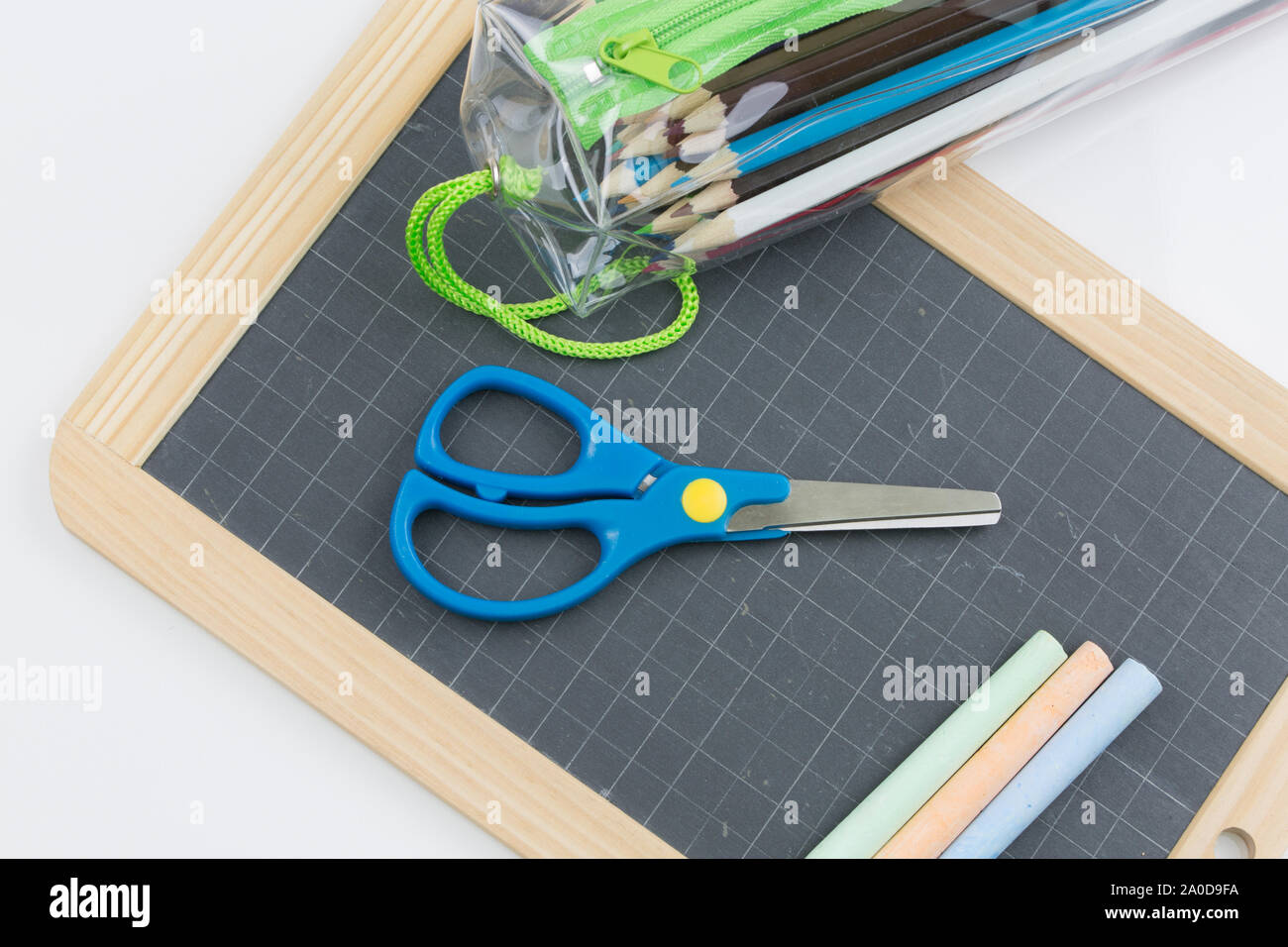 Closeup on colored chalk placed on a school slate Stock Photo