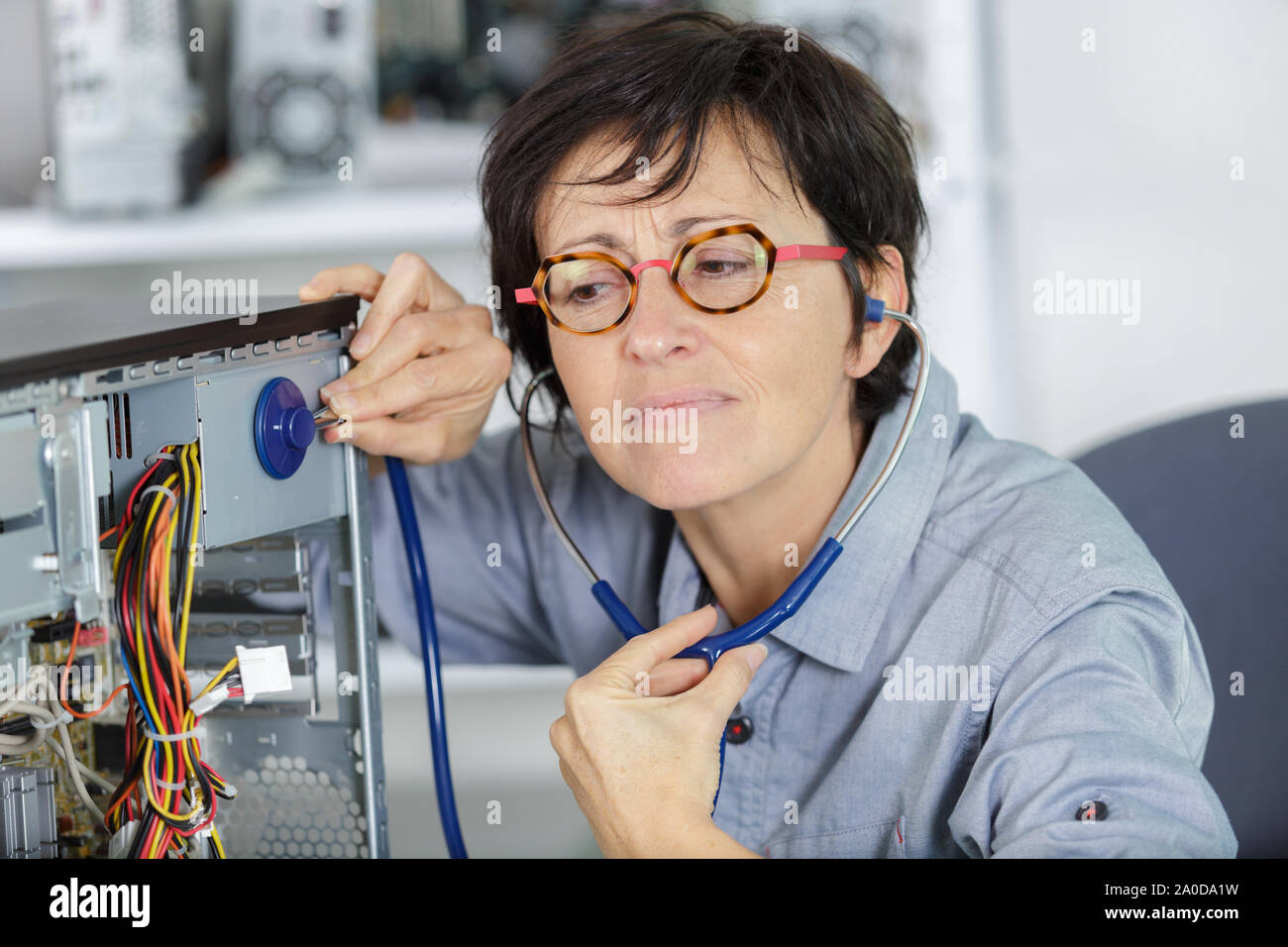 a woman uses a stetheoscope Stock Photo