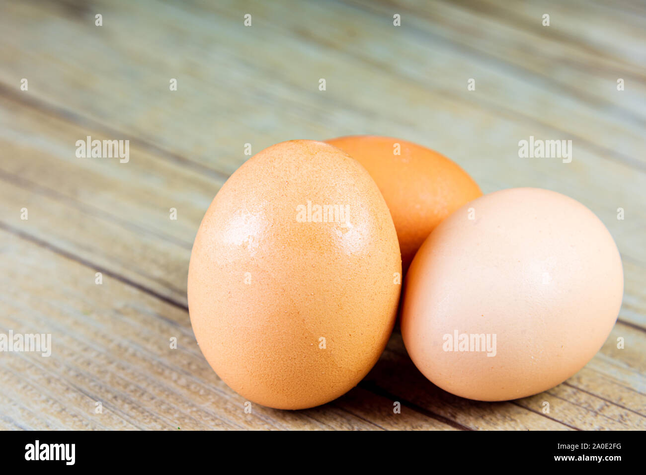 Three Eggs on a Wooden Background Stock Photo