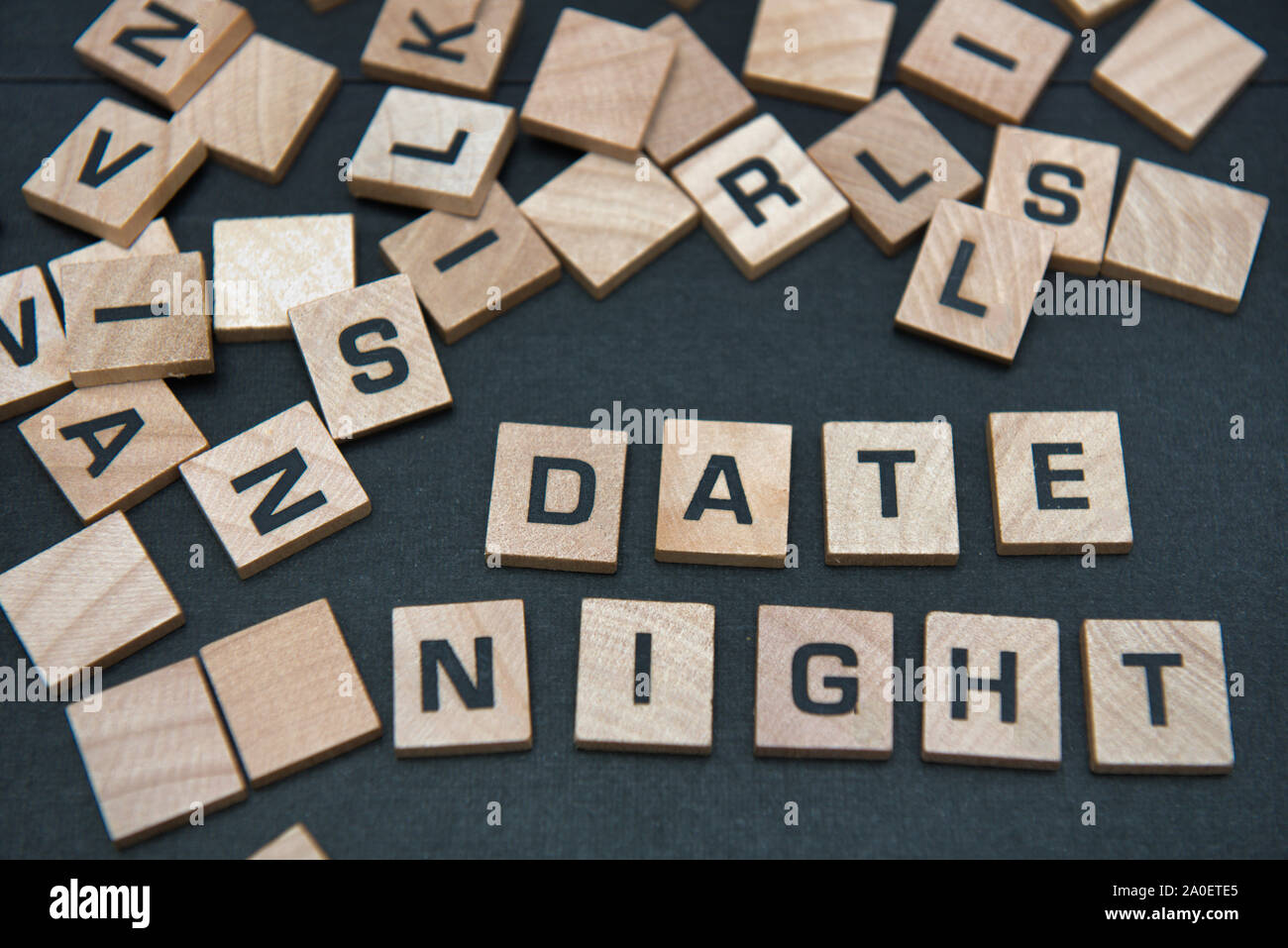 Letter tiles spelling out the words date night. Stock Photo