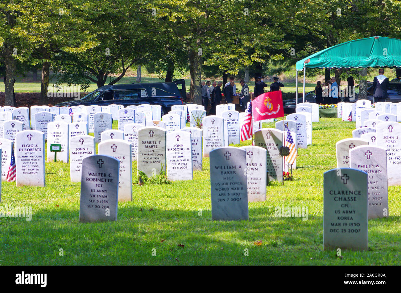 Middletown, CT USA. Aug 2013. Departed veteran being laid to rest with full military honors at one of the many State Veterans cemeteries nationwide. Stock Photo