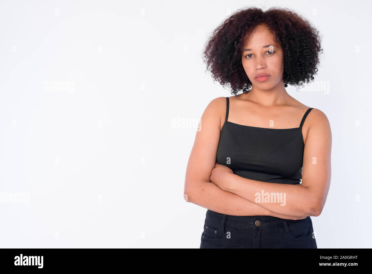 Portrait of young beautiful African woman with arms crossed Stock Photo ...