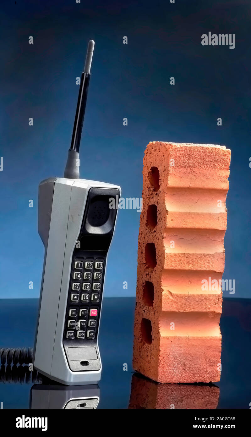 Old cell phone called the brick phone made in the early 1980's. Stock Photo