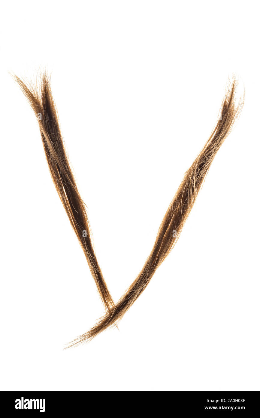 Letters made from woman hair capital V isolated on white background