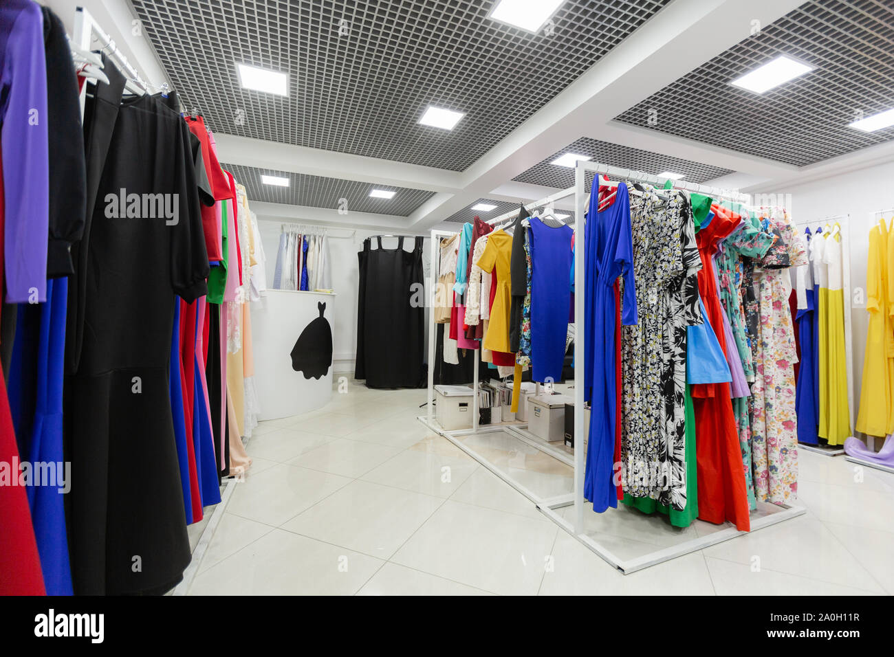 Clothing store with lots of dresses on hangers Stock Photo Alamy