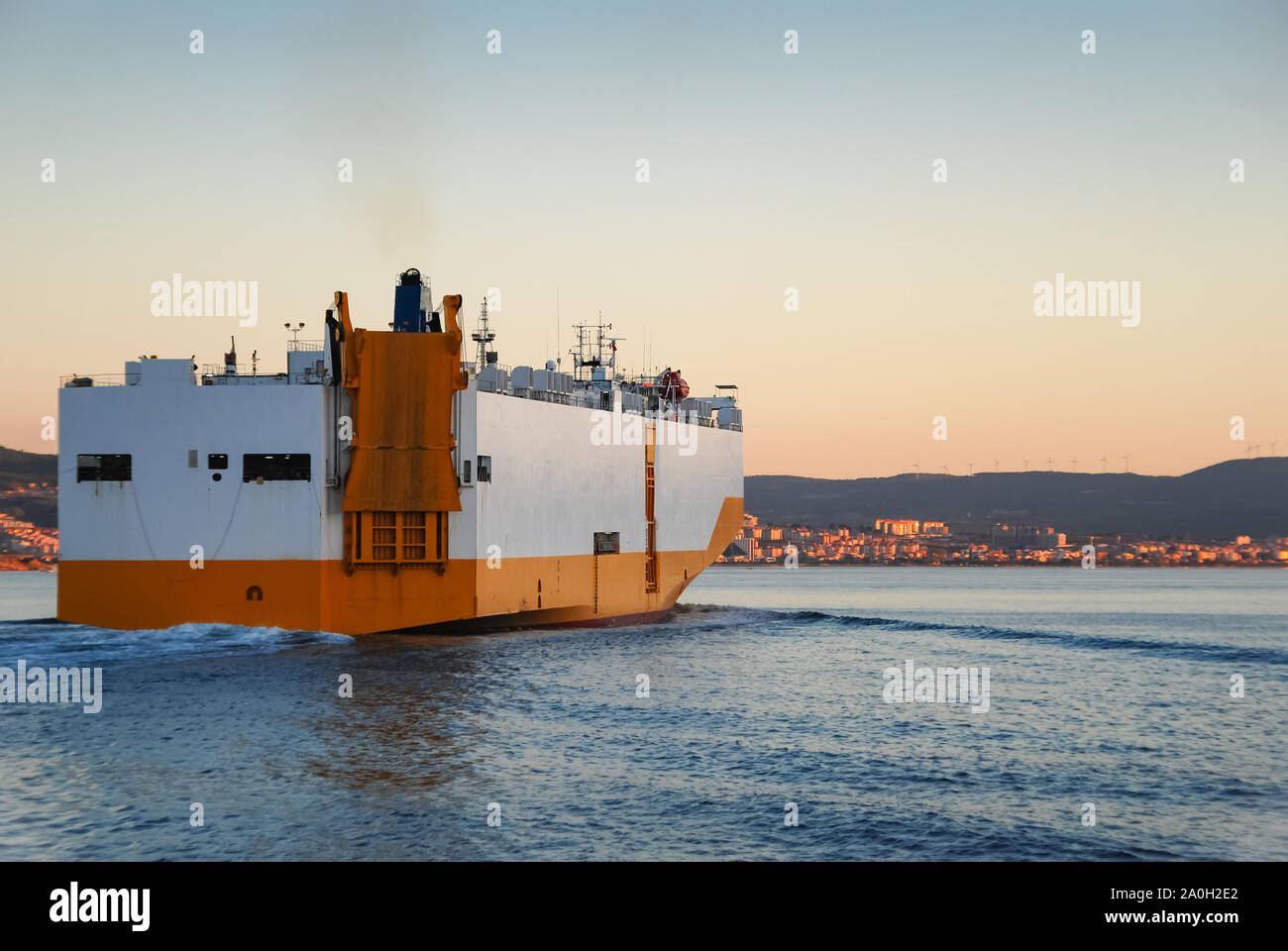Large Roll-on roll-off RORO or ro-ro ship or oceangoing vehicle carrier ship sailing in the sea. Roro ship designed to carry wheeled cargo such as car Stock Photo