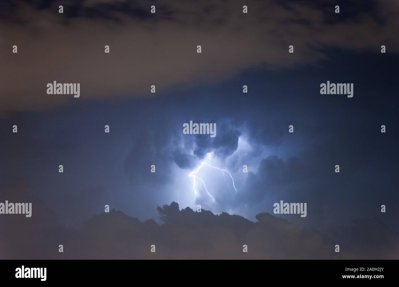 Lightning at cloudy dark sky scene. Stock Photo