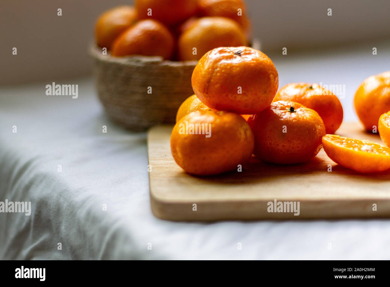 Still life photo of fresh clementine oranges to show concept of health, nutrition, clean living