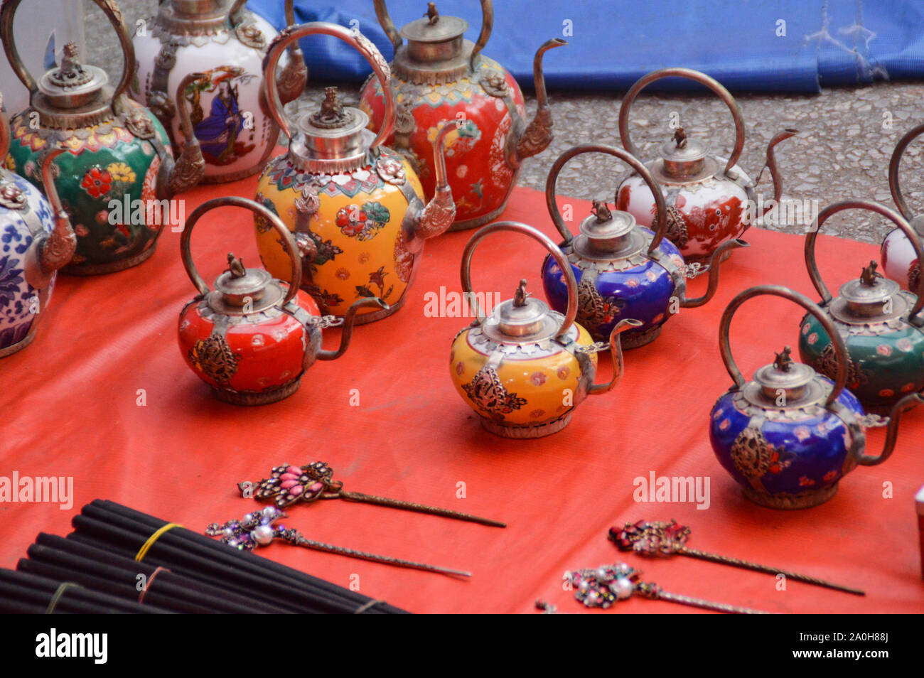 Beautiful hand-crafted porcelain teapots sold as souvenirs in the local market of Luang Prabang, Laos Stock Photo