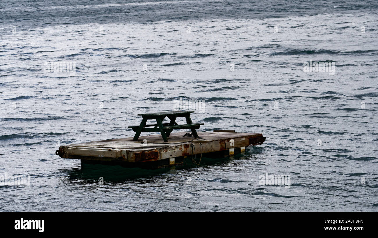 Picnic table on a raft floating in the Marlborough Sounds, New Zealand