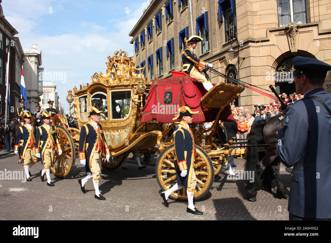 On the third Tuesday of September the Golden Coach with Queen Beatrix left Noordeinde Palace to the Ridderzaal during Prinsjesdag annual procession. Stock Photo