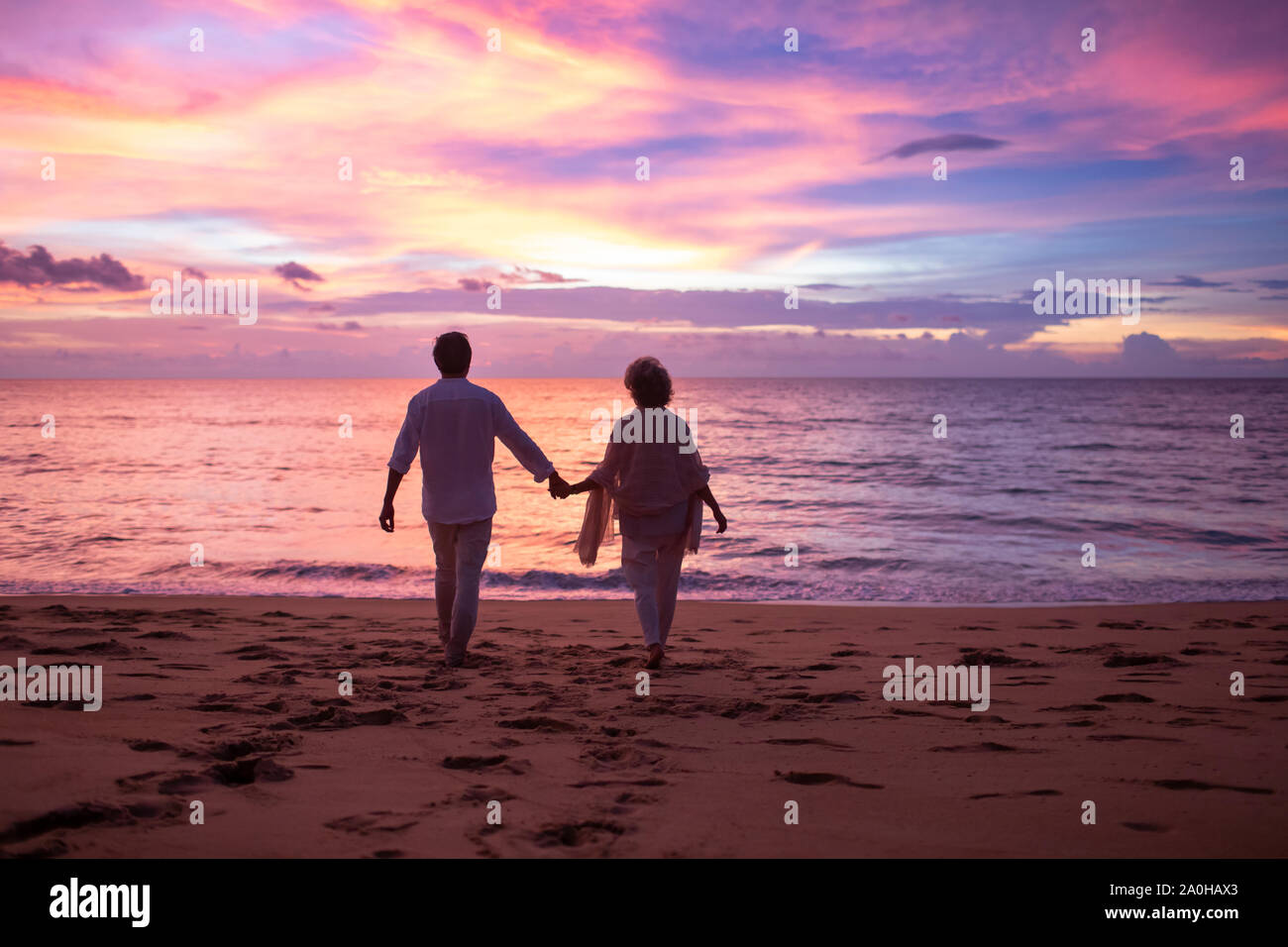 Happy senior couple on beach Stock Photo - Alamy