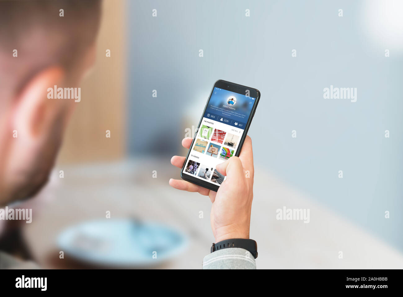 Guy use social network on smart phone concept. Stock Photo