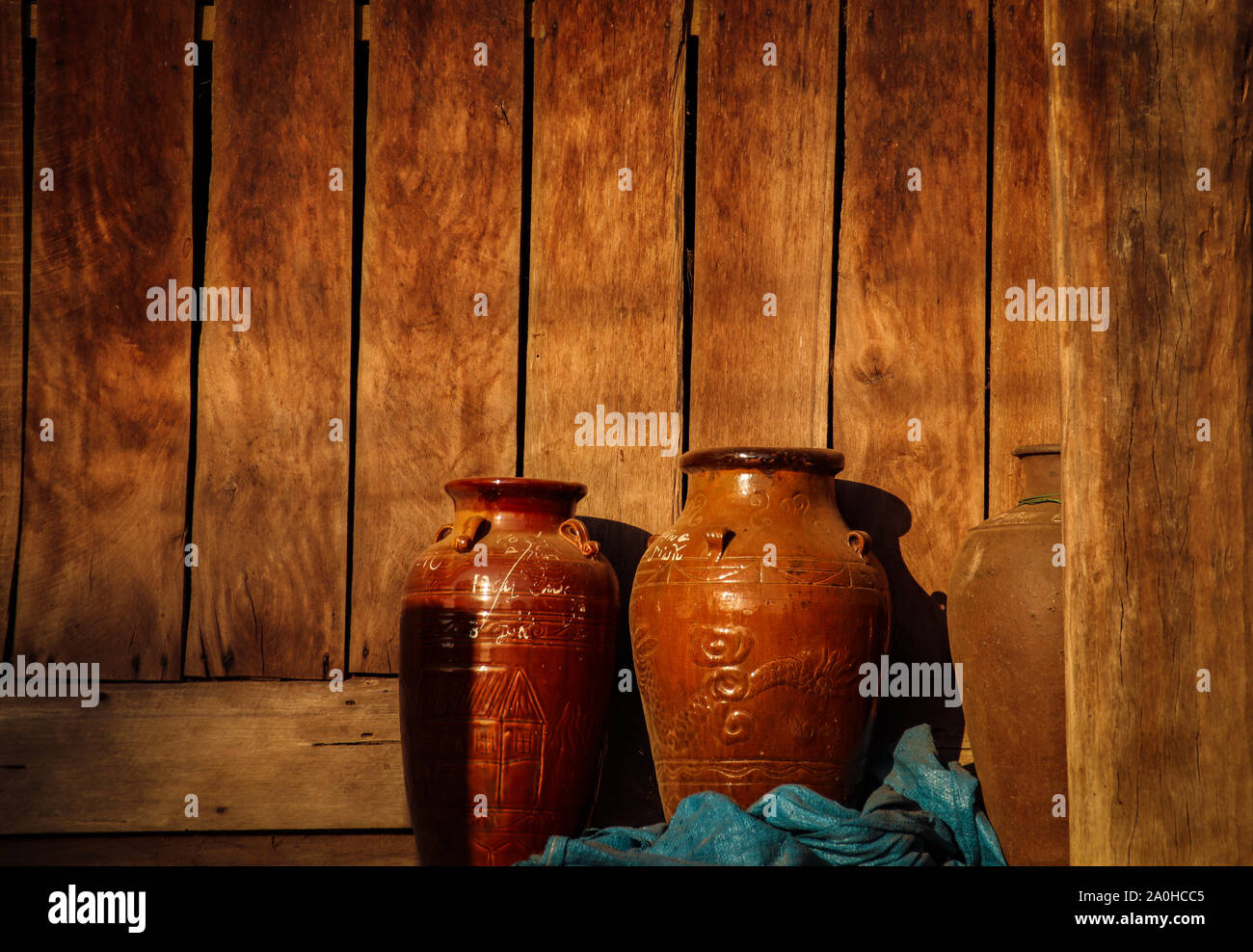 Earthen ware jars that traditionally use by the hmong people as containers for preserving food, shows the village life and culture in Lien son Vietnam Stock Photo