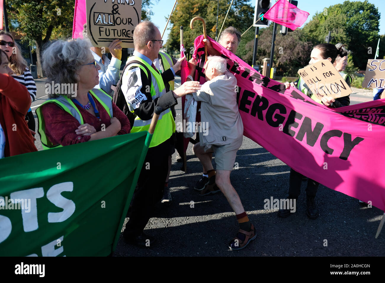 Worcester, Worcestershire, UK – Friday 20th September 2019 – One counter protester breaks through the Extinction Rebellion ( XR ) climate protesters as activists block commuter roads and traffic during the morning rush hour to raise awareness of climate change as part of the XR Global Climate Strike.  Photo Steven May / Alamy Live News Stock Photo