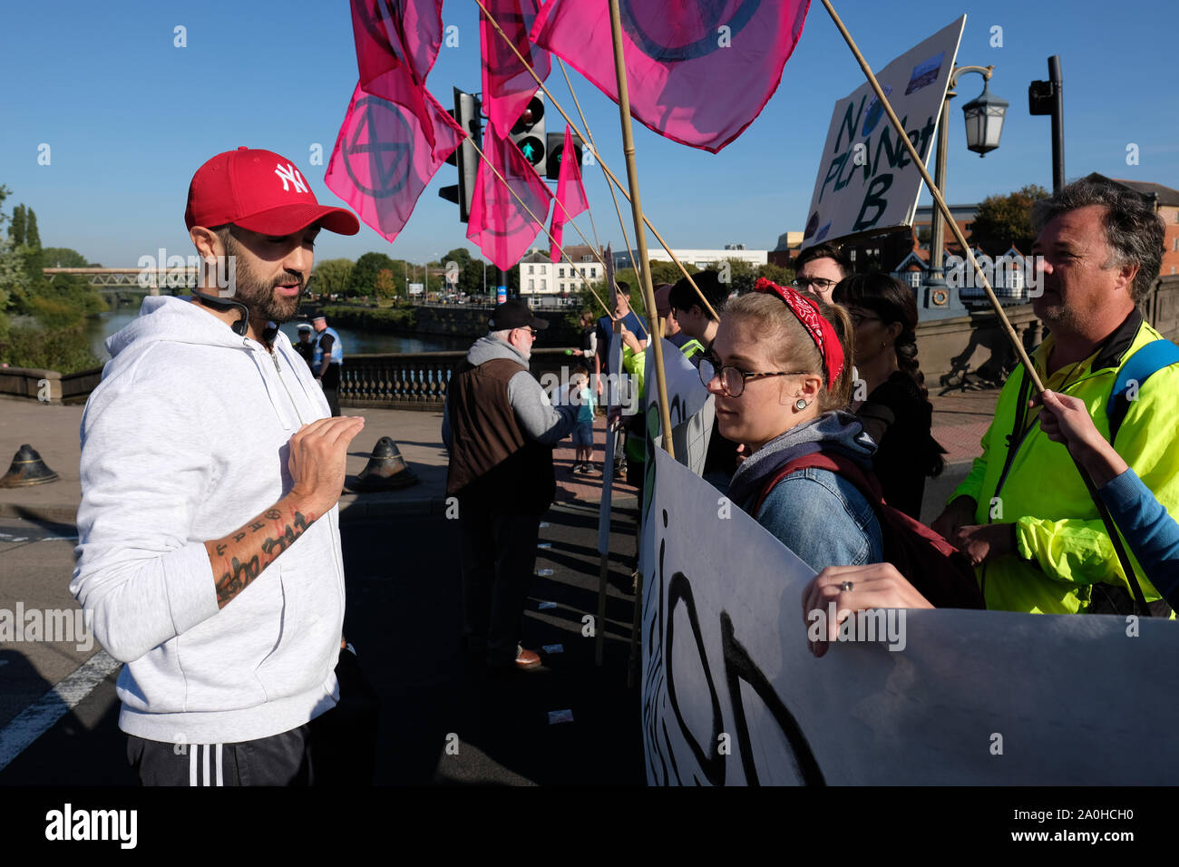 Worcester, Worcestershire, UK – Friday 20th September 2019 – One counter protester talks to the Extinction Rebellion ( XR ) climate protesters as activists block commuter roads and traffic during the morning rush hour to raise awareness of climate change as part of the XR Global Climate Strike.  Photo Steven May / Alamy Live News Stock Photo