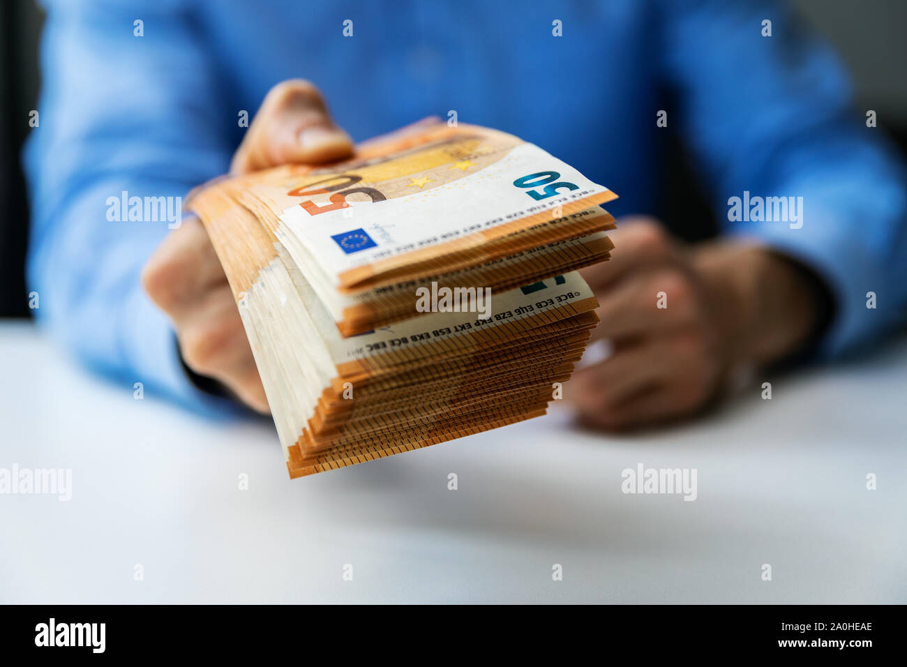 salary, money loan or prize concept - hand gives cash money Stock Photo