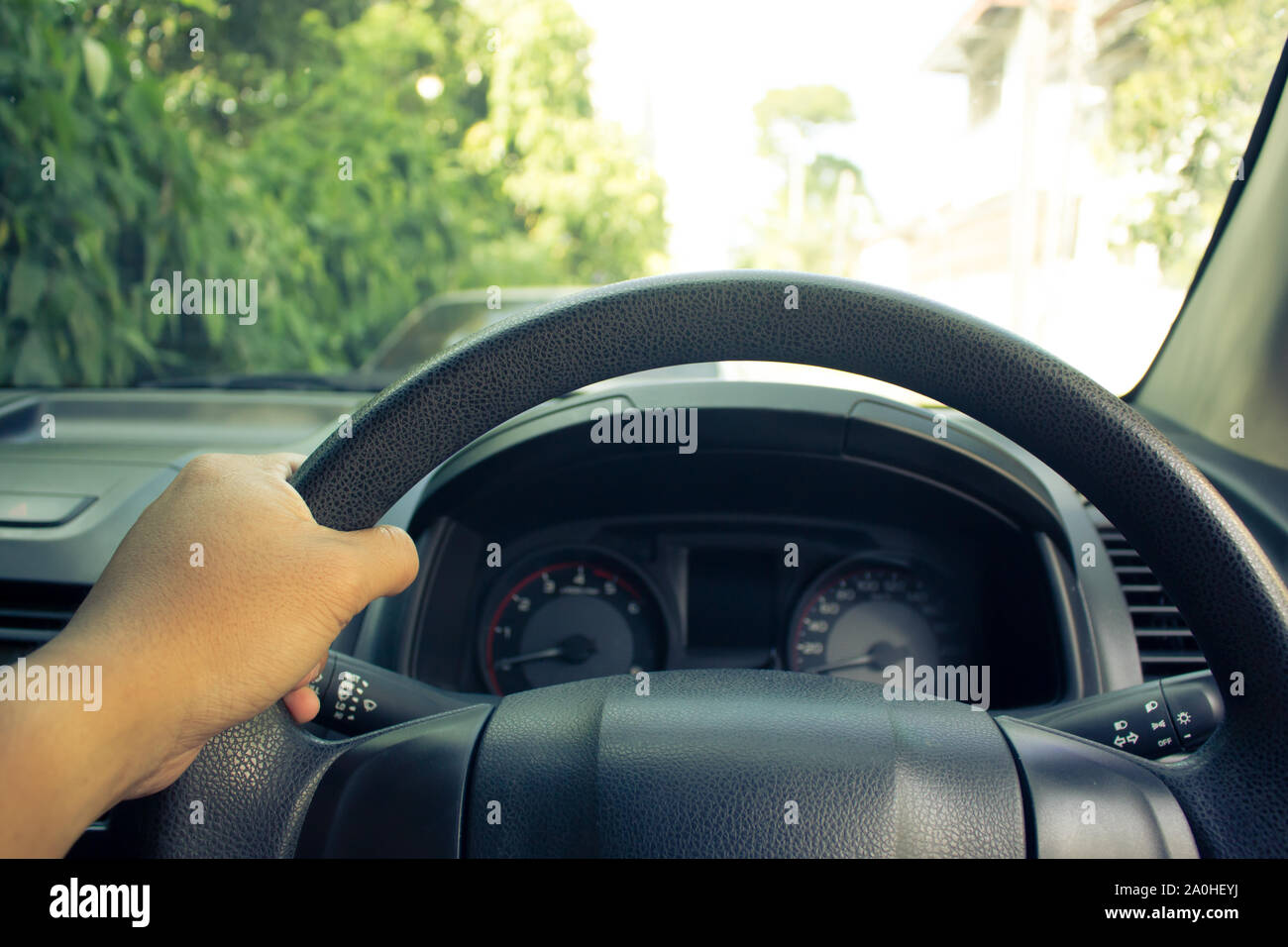 Hand on steering wheel while driving forward. Control of steering in the driving safety Stock