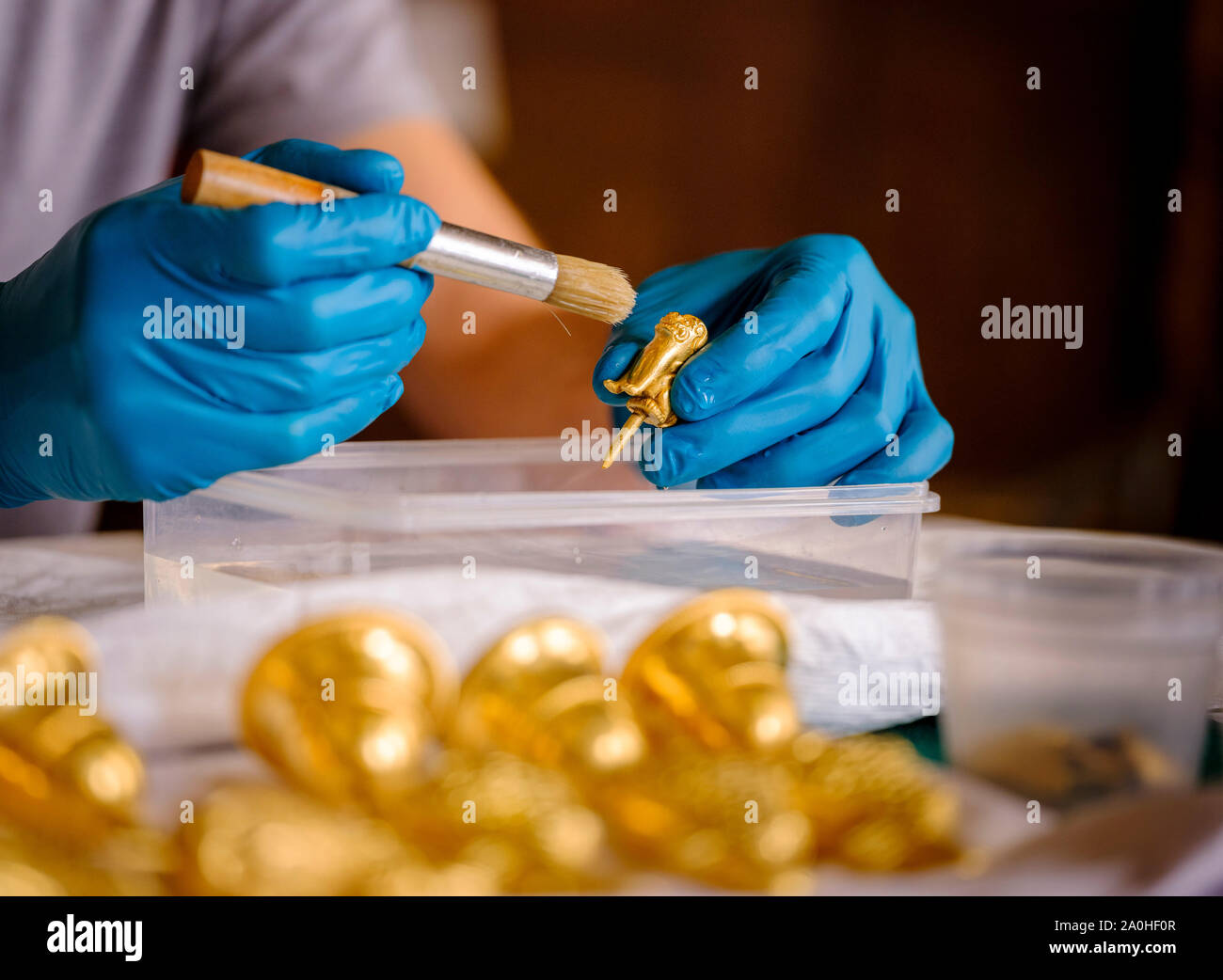 Brighton, East Sussex, UK. 20 September 2019.  The finishing touches are made to a new exhibition opening at the Royal Pavilion in Brighton. The exhibition called ‘A Prince’s Treasure: from Buckingham Palace to the The Royal Pavilion, The Royal Collection Returns To Brighton’ runs for two years. Pictured a conservator cleaning some of the small items.Credit: Jim Holden/Alamy Live News Stock Photo