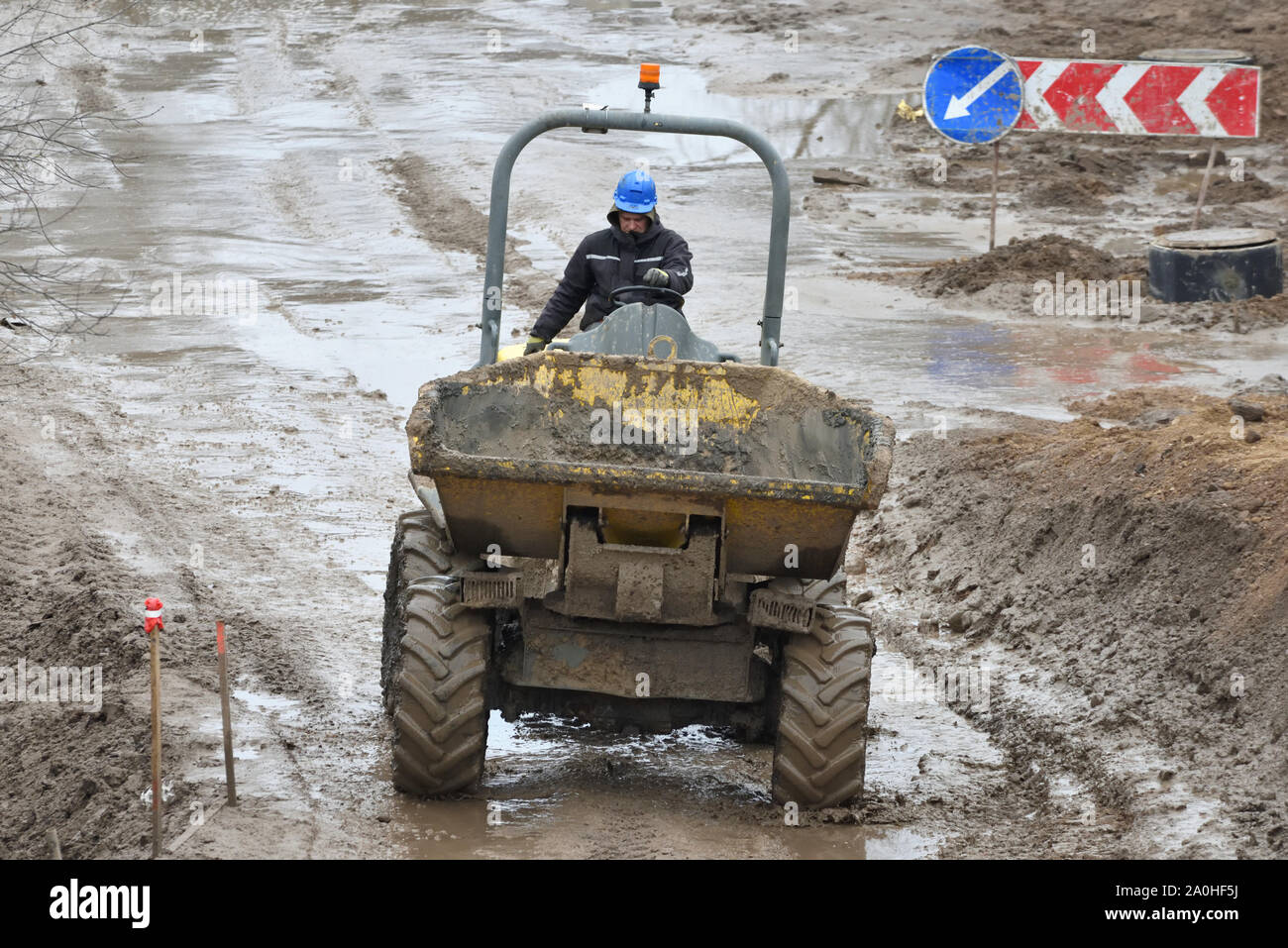 Vilnius, Lithuania - February 16: Small Dump Truck hauling ground during road construction on February 16, 2019. Vilnius is the capital of Lithuania a Stock Photo