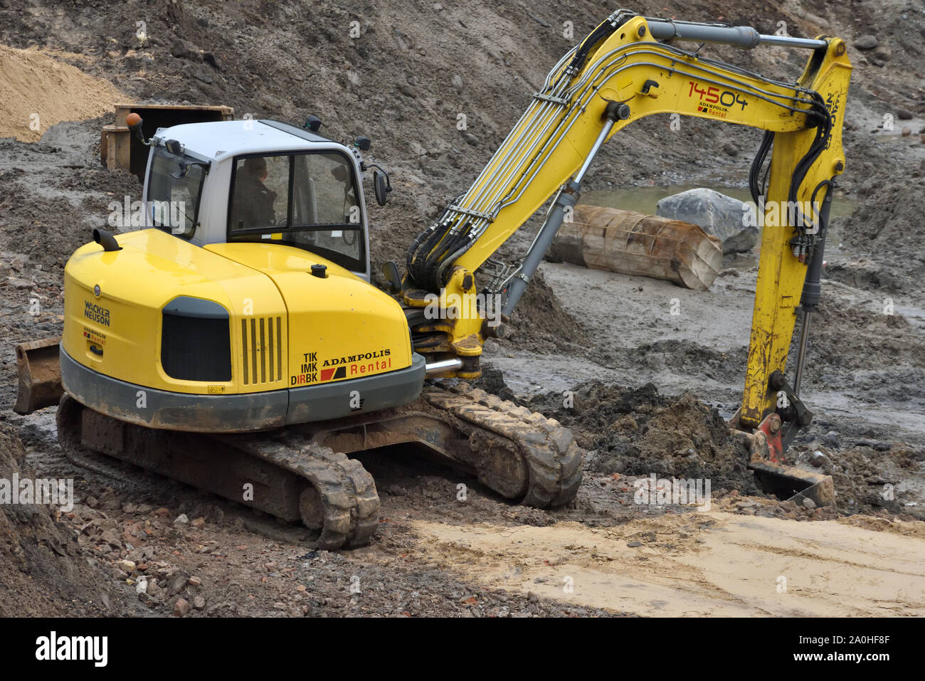 Vilnius, Lithuania - February 16: Excavator on construction site on February 16, 2019. Vilnius is the capital of Lithuania and its largest city. Stock Photo