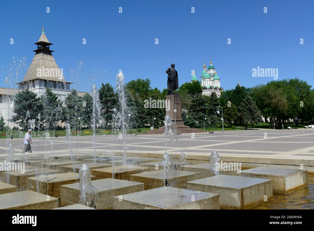 The Kremlin in Astrakhan, Astrakhan Oblast, Russia. Fountain and statue of Lenin outside the wall. Stock Photo