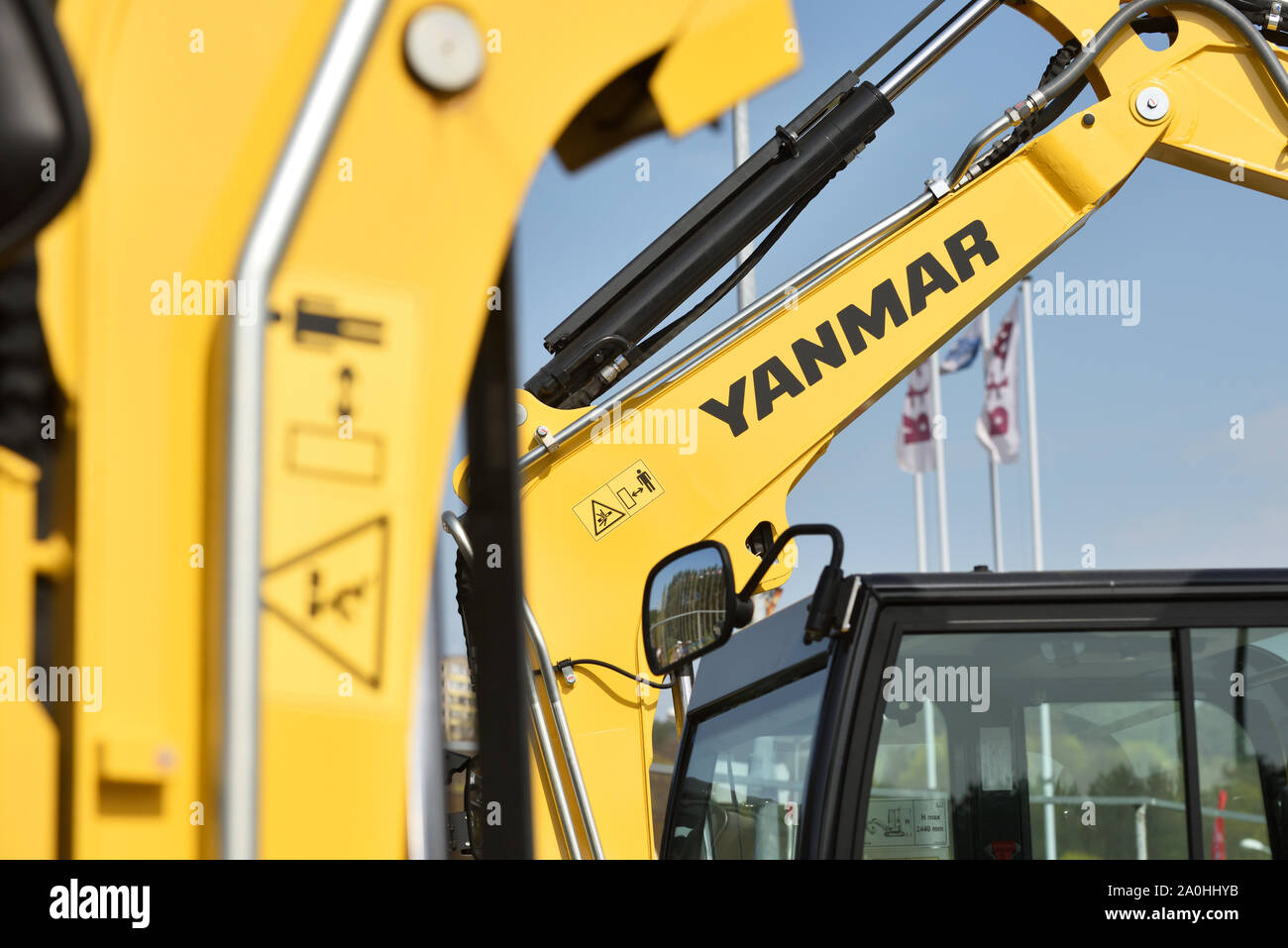 Vilnius, Lithuania - April 25: Yanmar excavator and logo on April 25, 2019 in Vilnius Lithuania. Yanmar is a Japanese company involved in the manufact Stock Photo
