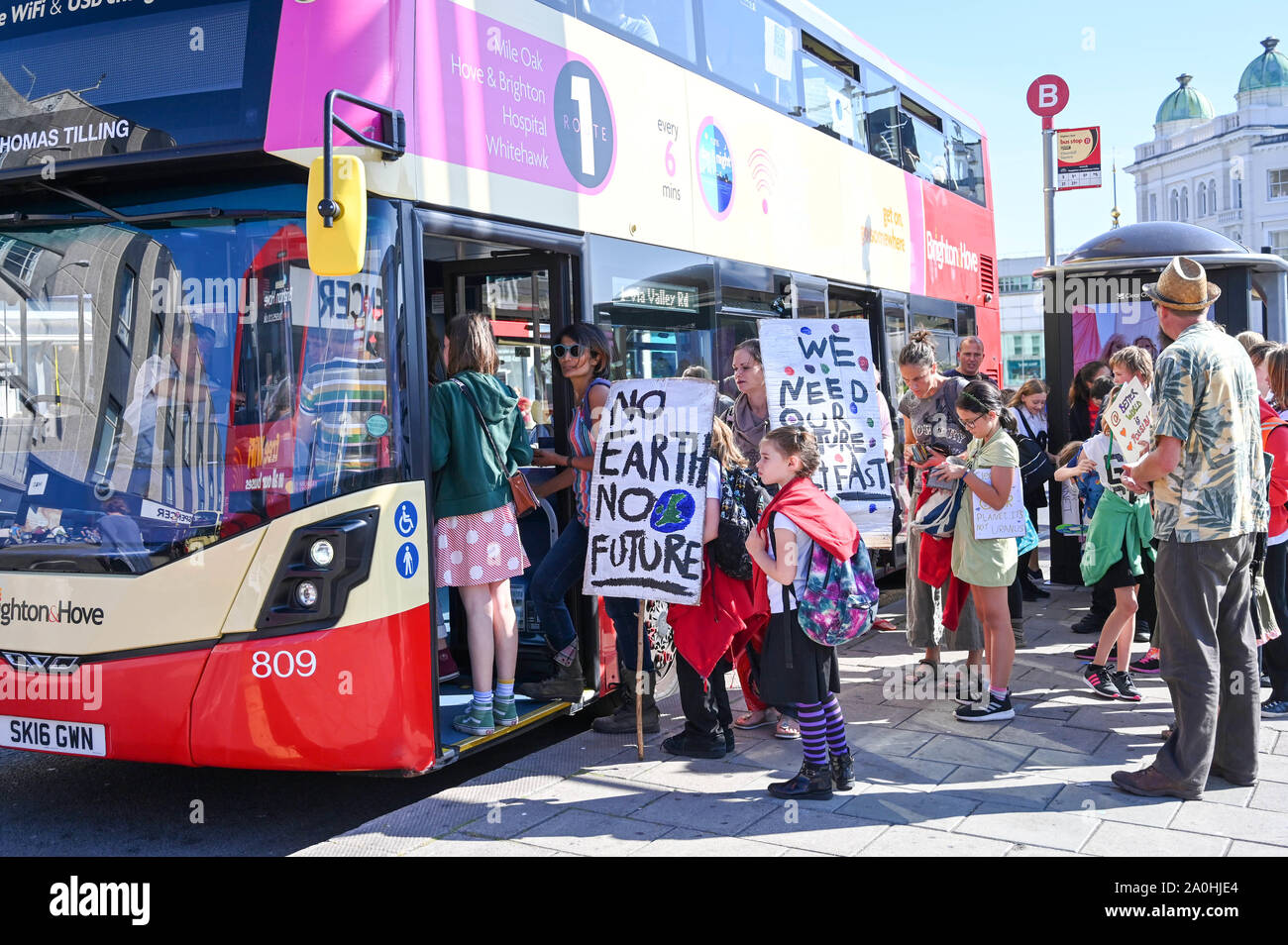 Brighton UK 20 September 2019 - School children catch a bus from the centre of Brighton to take part in the Global Climate Strike protest march starting on Hove seafront before heading through Brighton . Adults have been urged to join thousands of children taking part in the worldwide protests against the lack of action by government in combating climate change Credit : Simon Dack / Alamy Live News Stock Photo