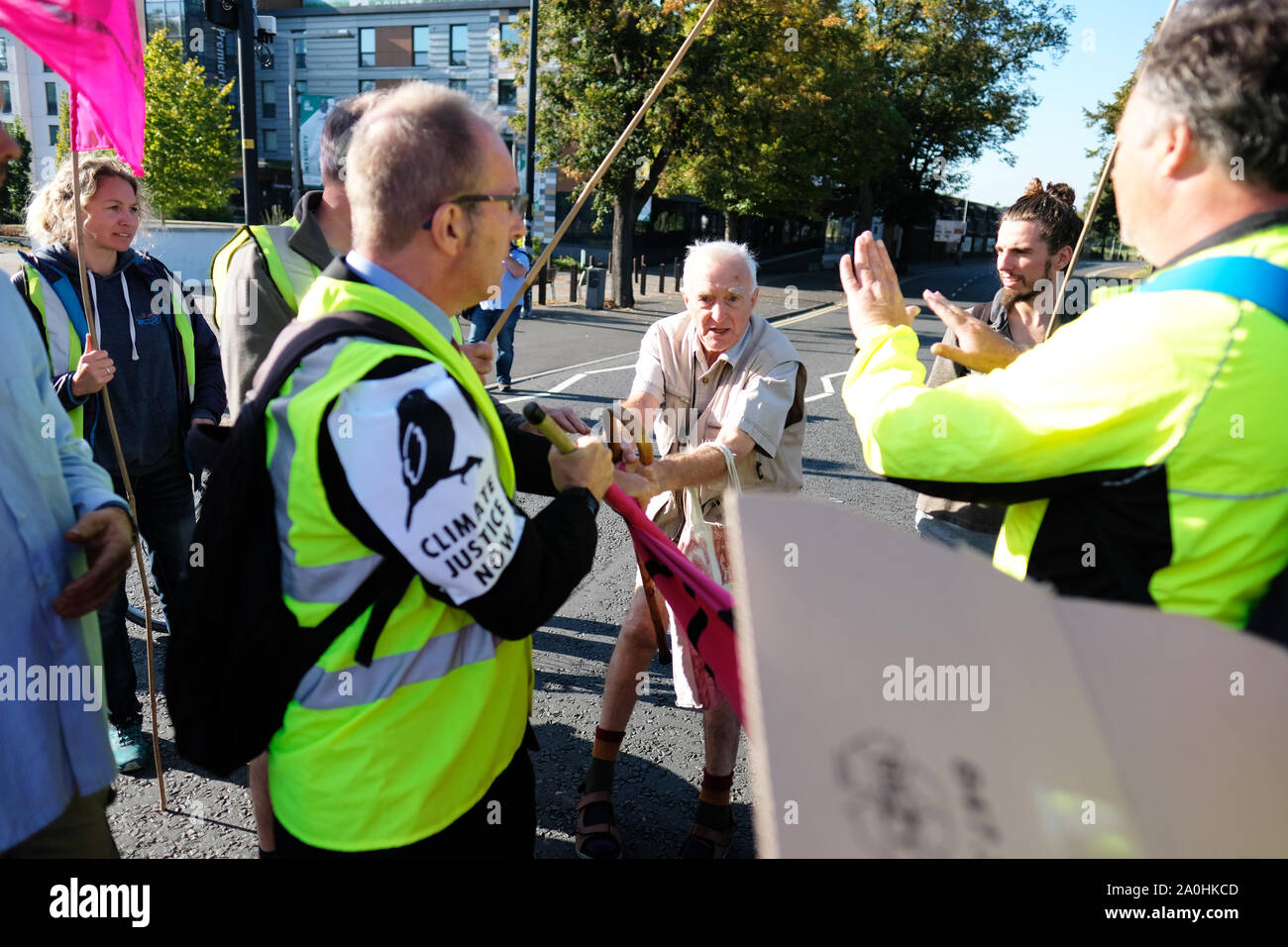 Worcester, Worcestershire, UK – Friday 20th September 2019 – One counter protester ( centre ) tangles with the Extinction Rebellion ( XR ) climate protesters as activists block commuter roads and traffic during the morning rush hour to raise awareness of climate change as part of the XR Global Climate Strike.  Photo Steven May / Alamy Live News Stock Photo