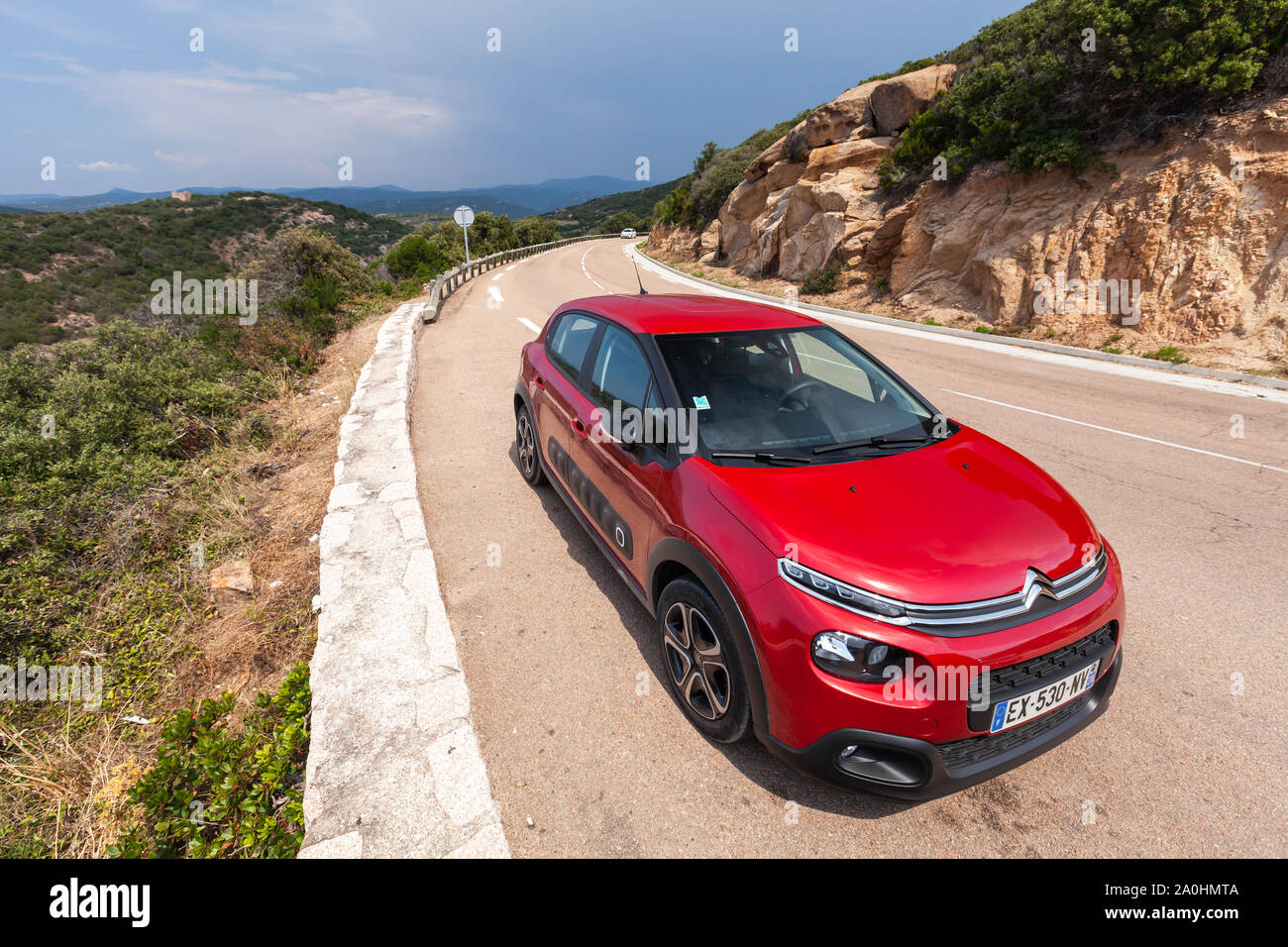 Corsica, France - August 22, 2018: Red Citroen C3 stands on a roadside, this is a supermini car produced by Citroen since April 2002 Stock Photo