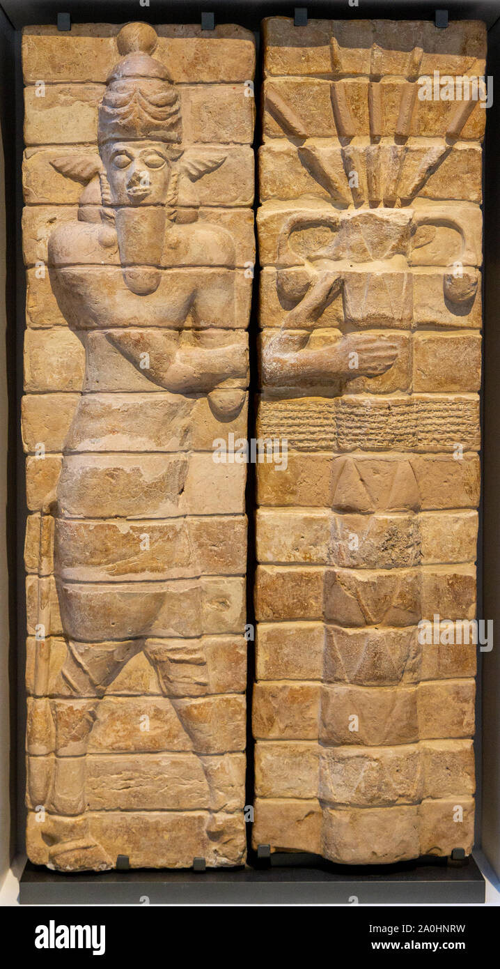 Fragments of decoration from the temple of Inshushinak, tutelary god of Susa: bull-man and palm tree (symbol of fertility). Around 1150BC. Susa, Iran. Stock Photo