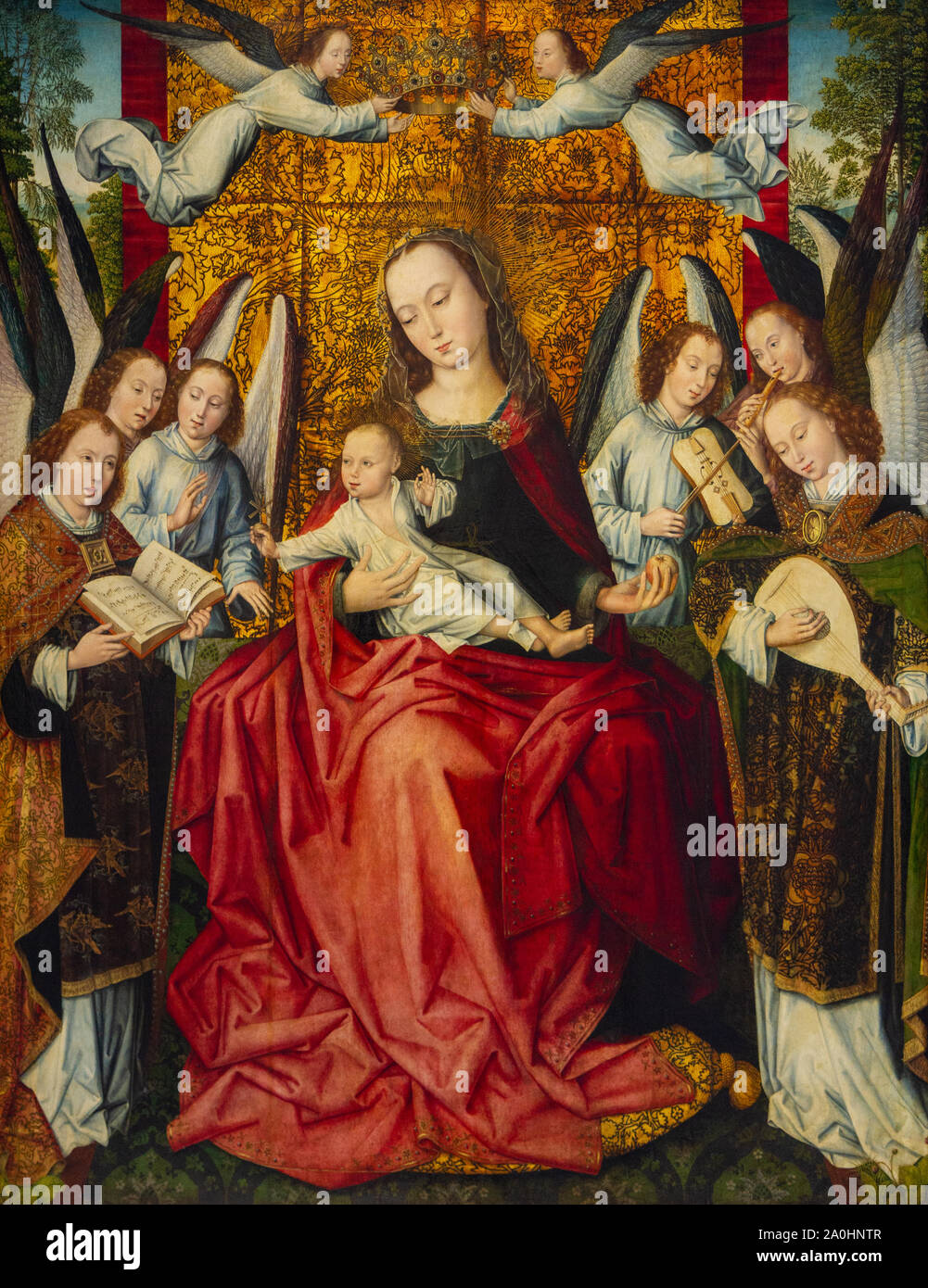 Virgin Mary with Infant Jesus surrounded by angels singing and playing instruments. The Louvre Museum in Lens, France. Stock Photo