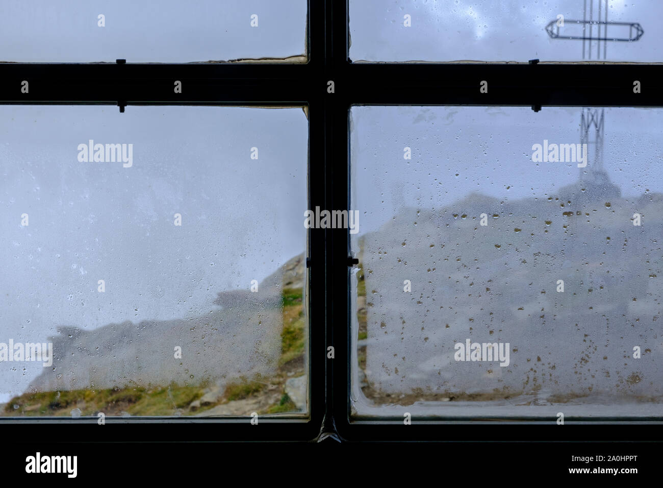 foggy day from the window of a bivouac in the italian alps Stock Photo