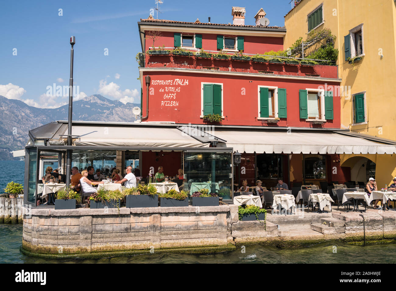 Restaurant on the lakeside in Lake Garda Stock Photo Alamy