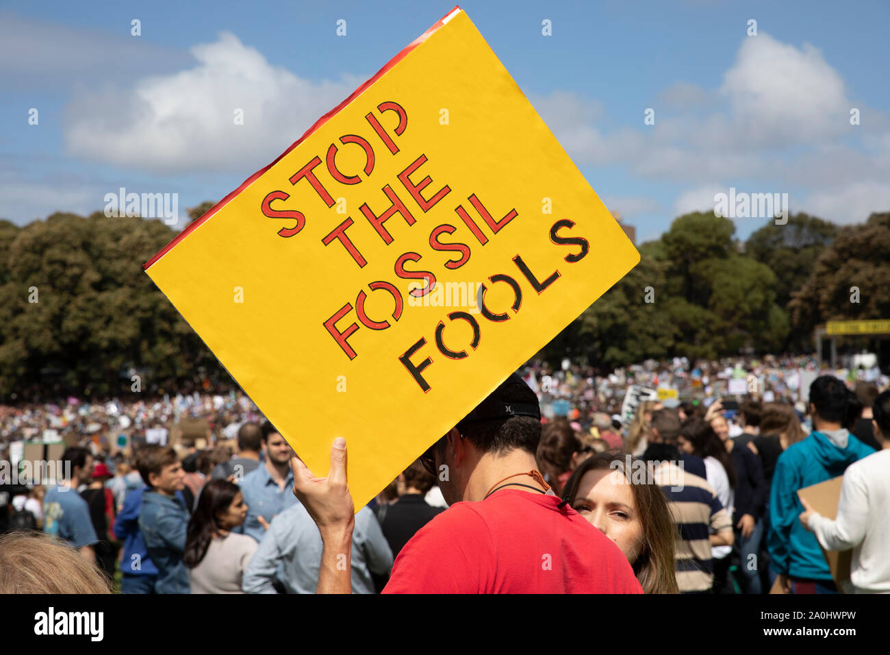 Stop the fossil fools placard at Sydney climate change strike rally in the Domain,Australia Stock Photo