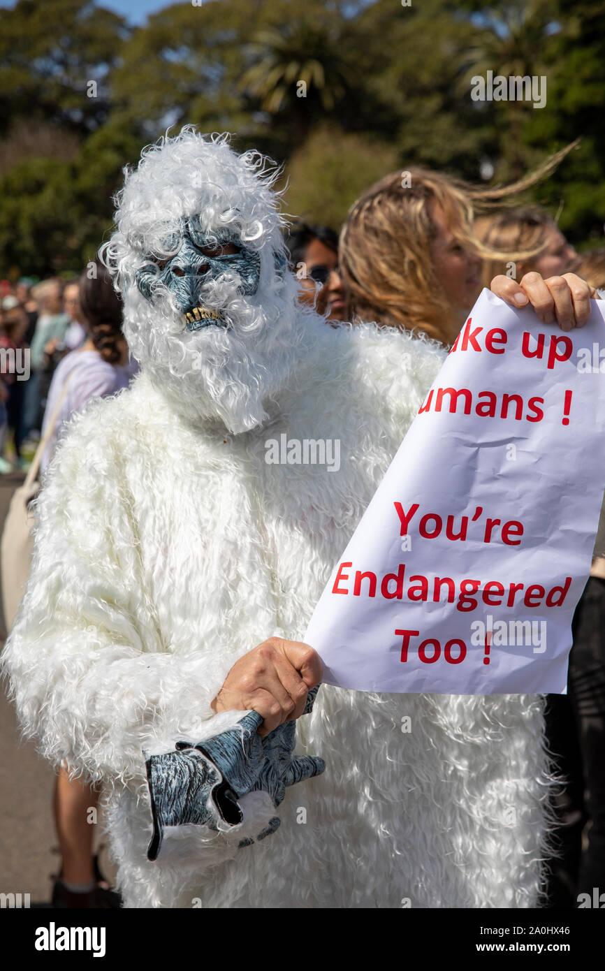 Fancy dress climate change protestor in Sydney,Australia holding a endangered sign Stock Photo