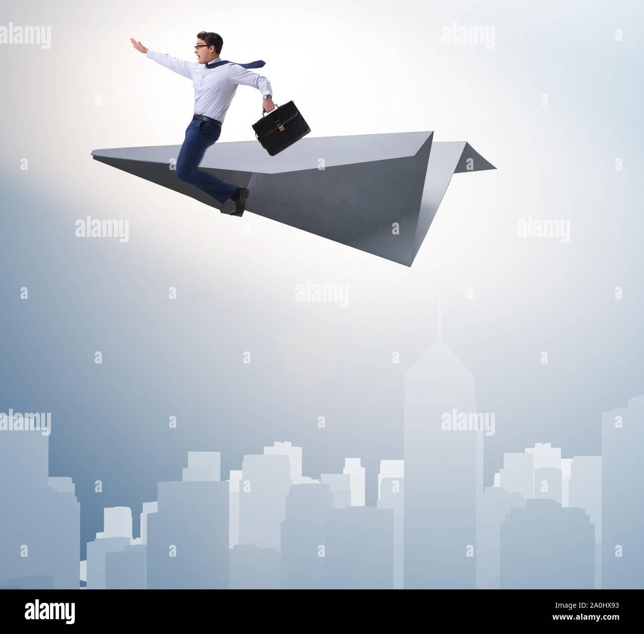 The businessman flying on paper plane in business concept Stock Photo ...