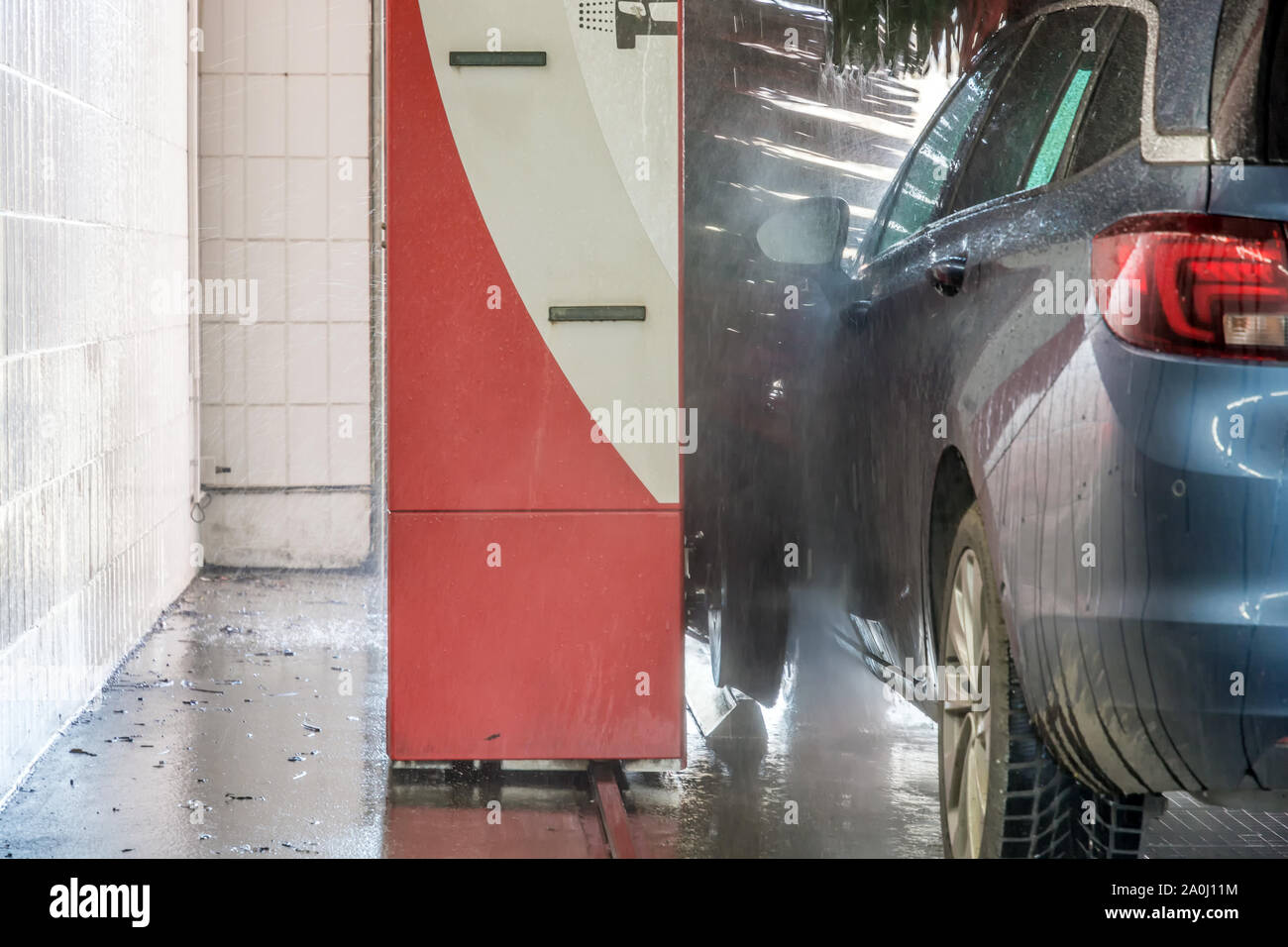 Car in a car wash with brushes Stock Photo Alamy