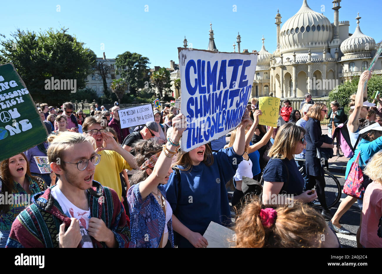 Brighton UK 20 September 2019 - Thousands of protesters march past the Royal Pavilion as they take part in the Global Climate Strike protest through Brighton . Adults have been urged to join thousands of children taking part in the worldwide protests against the lack of action by government in combating climate change Credit : Simon Dack / Alamy Live News Stock Photo