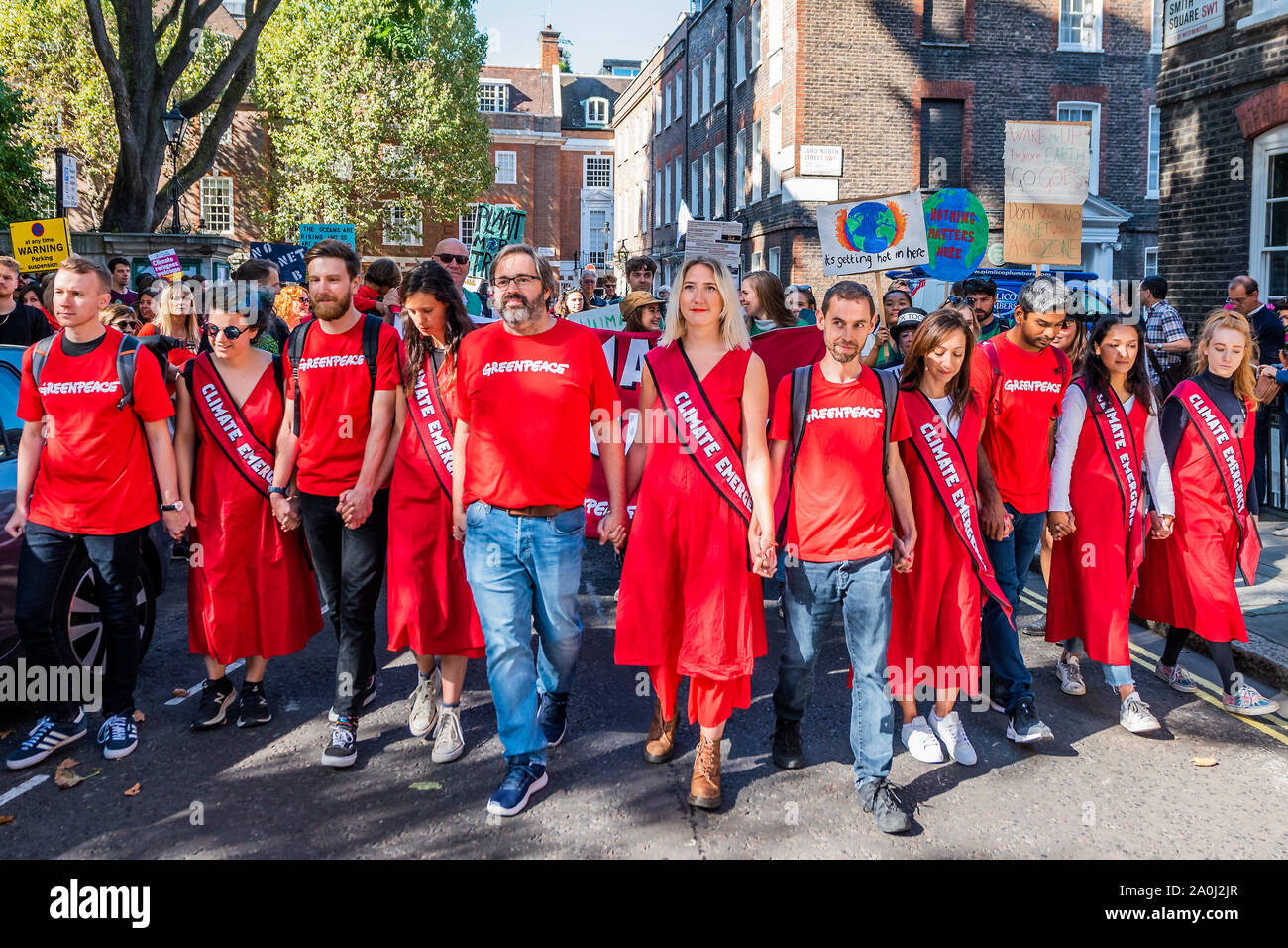 London, UK. 20th Sep, 2019. Greenpeace repriese their red dresses - A general strike for Climate Justice, attended by school children, students and adults, is organised by Extinction Rebellion, Greenpeace, Save the Earth and other groups campaigning for the environment. They are again highlighting the climate emergency, with time running out to save the planet from a climate disaster. This is part of the ongoing ER and other protests to demand action by the UK Government on the 'climate crisis'. The action is part of an international co-ordinated protest. Credit: Guy Bell/Alamy Live News Stock Photo