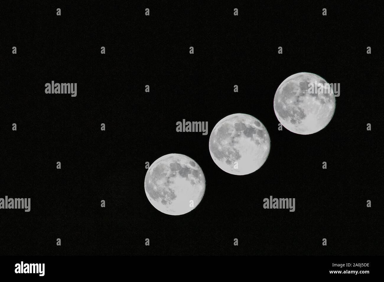 A multiple exposure image of the full moon captured in Colorado. Stock Photo