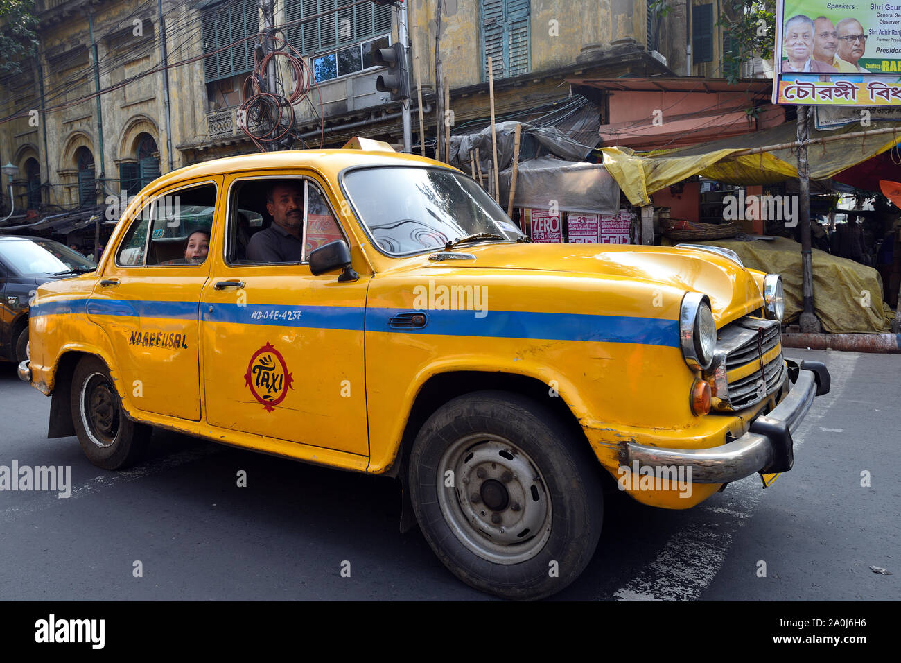 CALCUTTA, WEST BENGAL INDIA - 21 DECEMBER 2018: Yellow taxis on crowded streets of Calcutta in the West Bengal Stock Photo