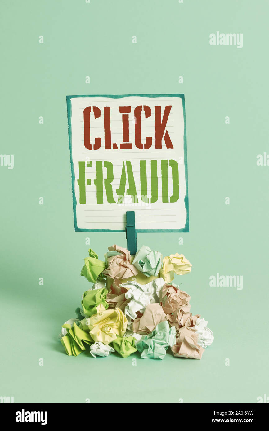 Word writing text Click Fraud. Business photo showcasing practice of repeatedly clicking on advertisement hosted website Reminder pile colored crumple Stock Photo
