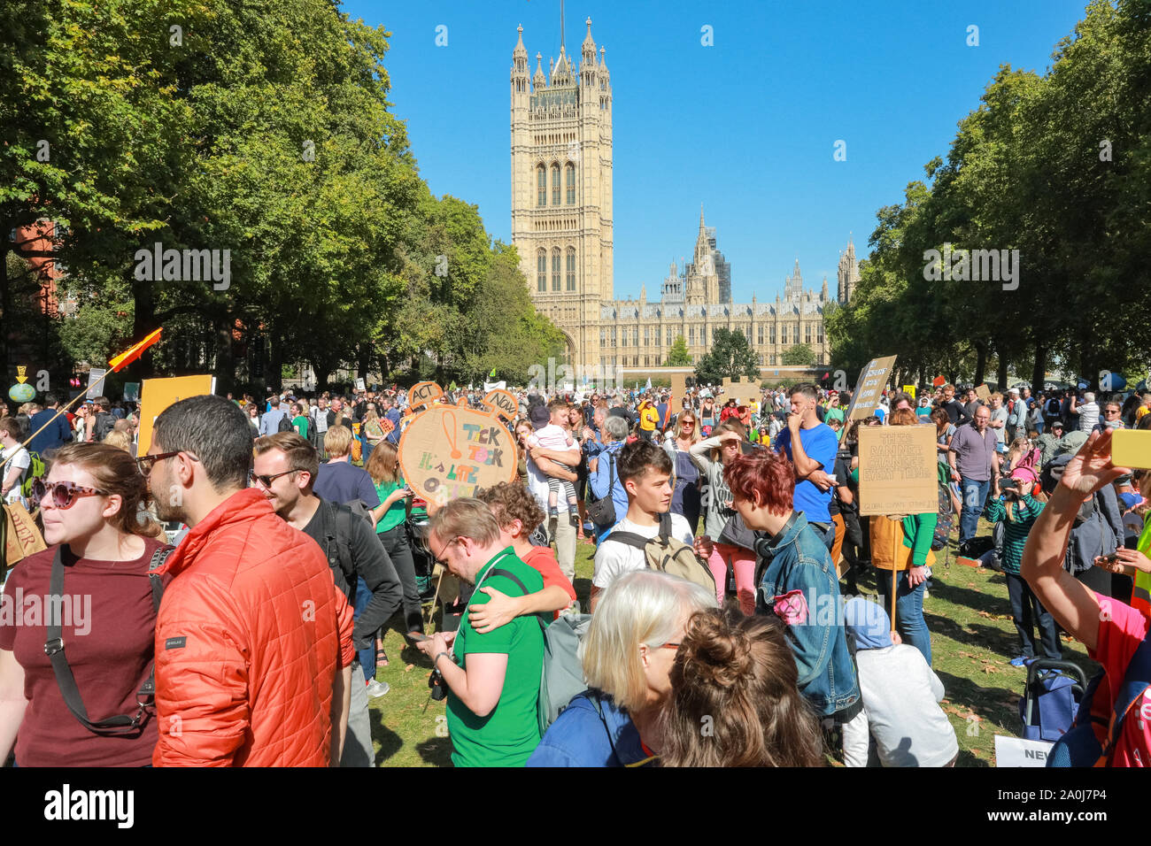Westminster, London, UK, 20th Sep 2019. Victoria Tower Gardens fills with people, many of the families with small children and strollers. Tens of thousands of children, young people and adults protest for climate action and against the causes of climate change in the British capital. Many similar protests take place in cities around the world in a day of global climate action in an event sparked by the young campaigner Greta Thunberg who attends the global climate strike in New York. Credit: Imageplotter/Alamy Live News Stock Photo