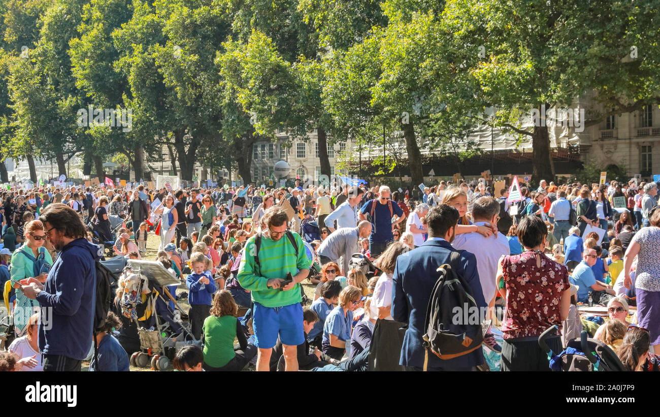 Westminster, London, UK, 20th Sep 2019. Victoria Tower Gardens fills with people, many of the families with small children and strollers. Tens of thousands of children, young people and adults protest for climate action and against the causes of climate change in the British capital. Many similar protests take place in cities around the world in a day of global climate action in an event sparked by the young campaigner Greta Thunberg who attends the global climate strike in New York. Credit: Imageplotter/Alamy Live News Stock Photo