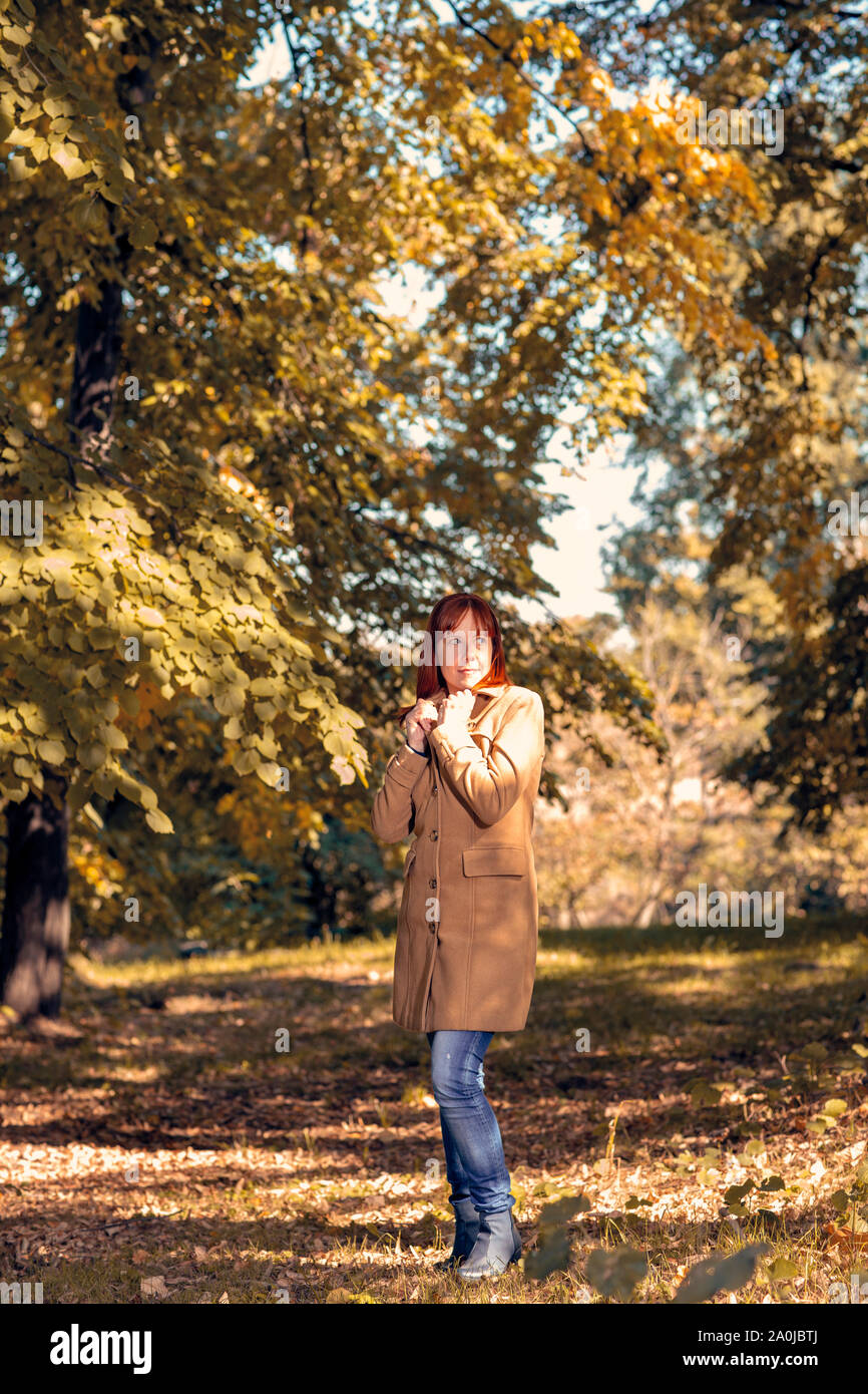 Happy Woman Enjoying Life in the Autumn on the Nature Stock Photo