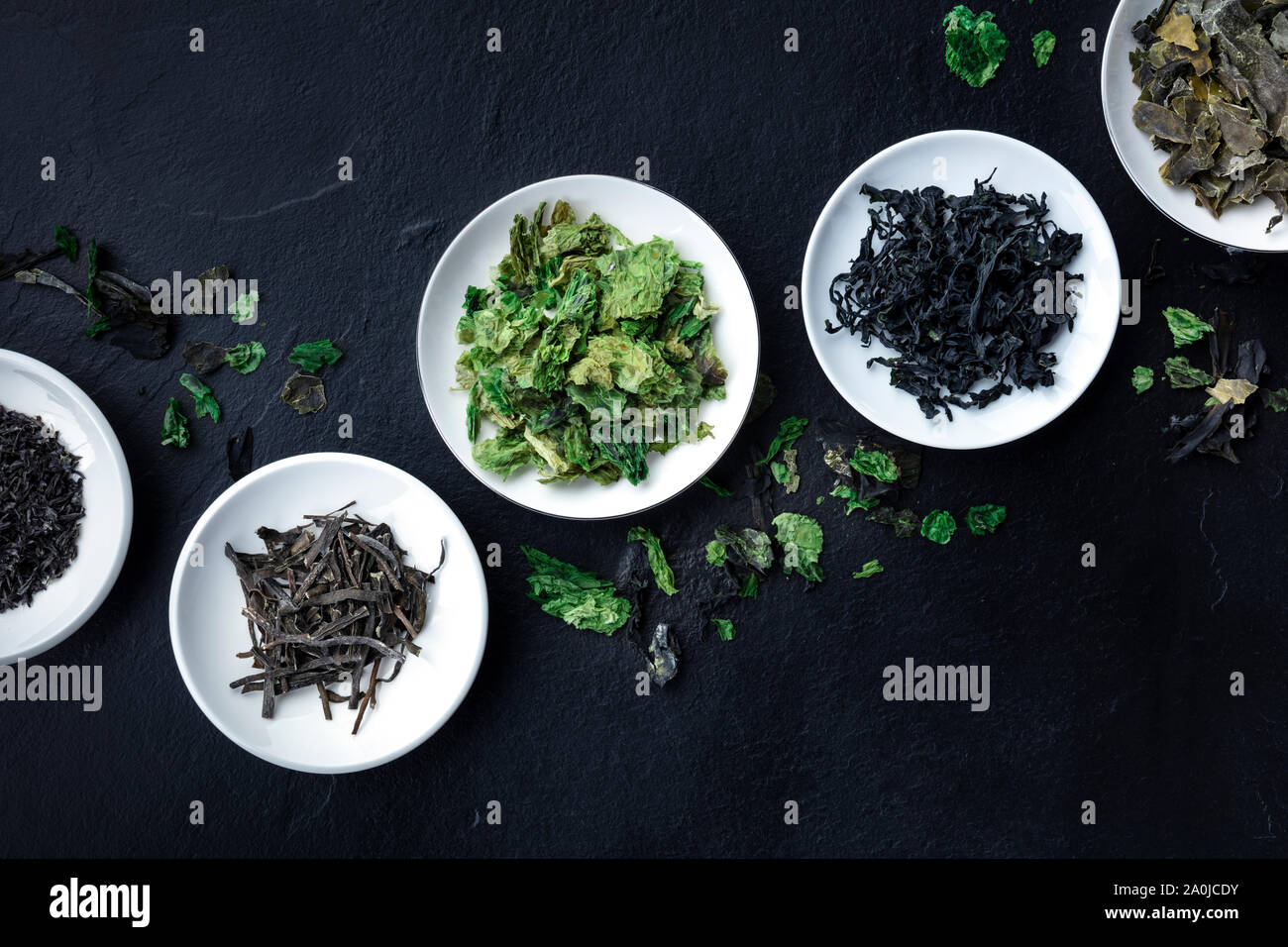 Various dry seaweed, sea vegetables, shot from the top on a black background with a place for text Stock Photo
