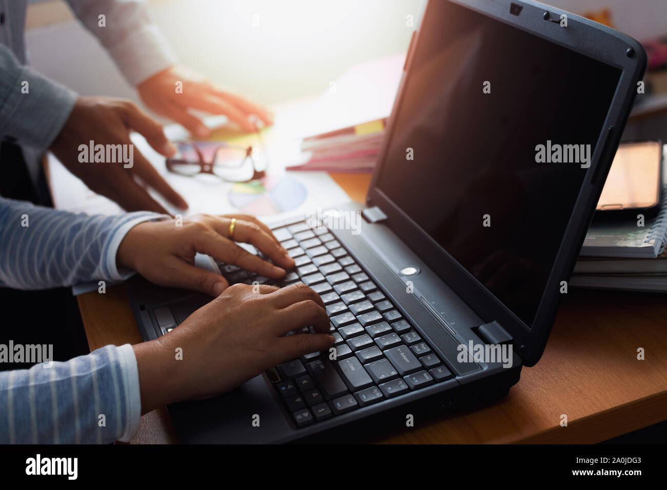Two colleagues discussing and planing together on office desk, Business concept. Stock Photo