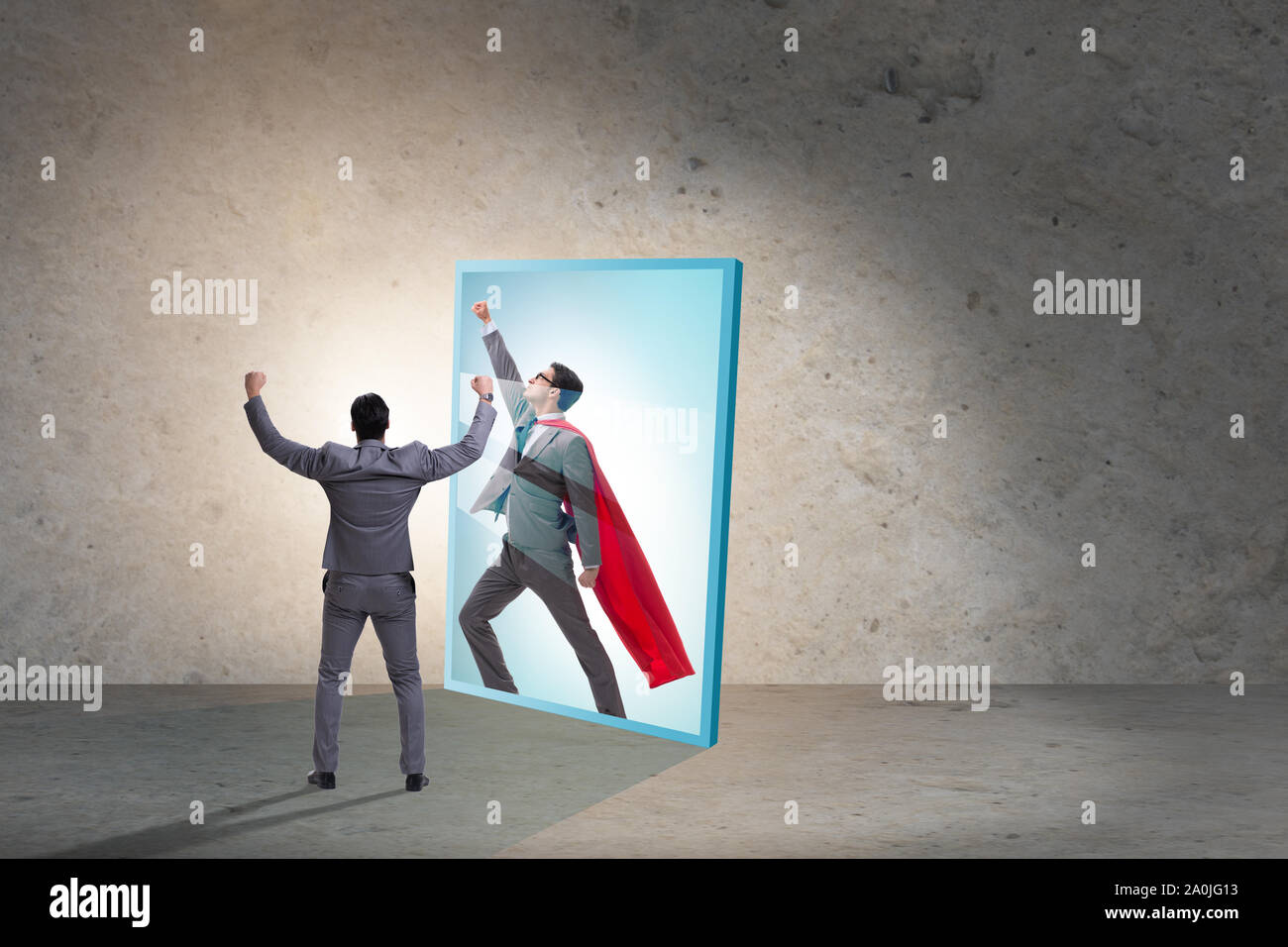 The businessman seeing himself in mirror as superhero Stock Photo - Alamy